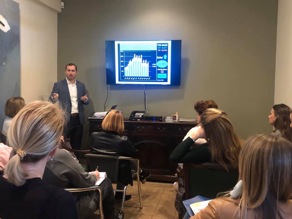 Christian Chacon presenting to a group of real estate professionals